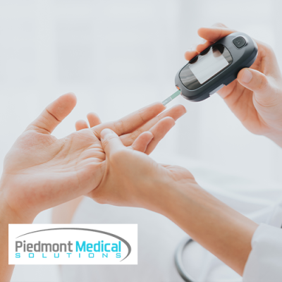 Person pricking finger to test their blood sugar level