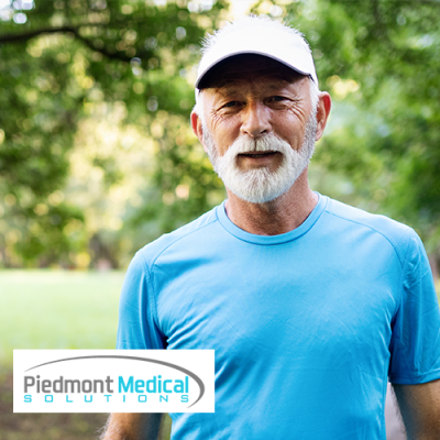 Older male wearing blue t-shirt